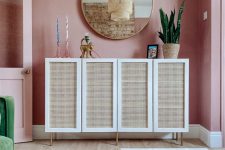 a lovely cabinet with cane webbing doors is a stylish idea for a mid-century modern space, it’s lovely