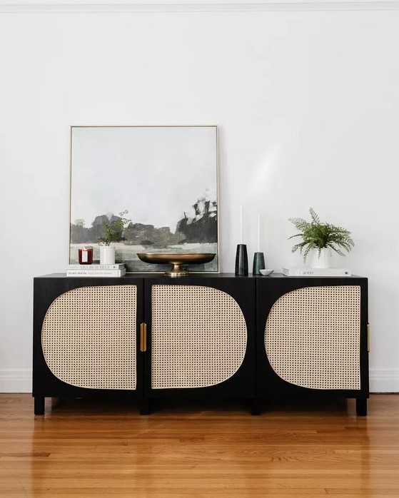 a lovely media console of an IKEA piece, in black and with cane doors is a very cool idea for a refined room