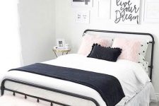 a lovely teen bedroom with a black metal bed, contrasting bedding, a pretty gallery wall and a pink faux fur bench