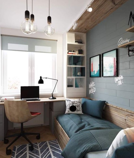 An industrial teen room with a faux brick wall, wooden touches, a bed, a built in desk and a storage shelf plus bulbs