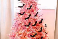 02 a beautiful pink Halloween tree with lights, black bats, a witch hat and black and white pumpkins is adorable