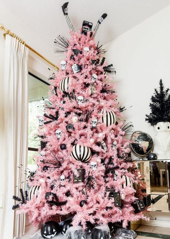 A creepy cute Halloween tree with black and white ornaments, striped ones, jack o lanterns and twigs