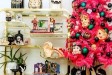 06 a pink Halloween tree with colorful ornaments and scary masks is a bold statement for your interior