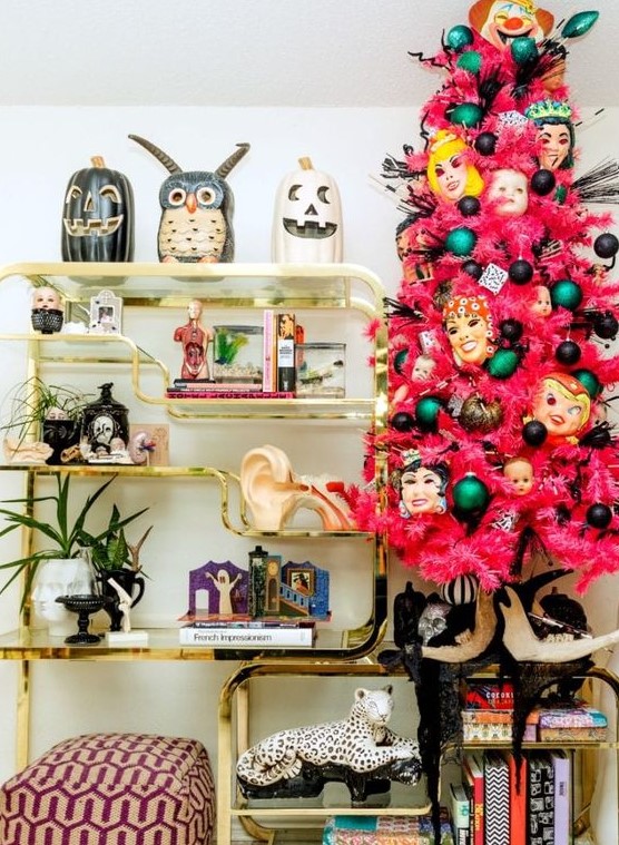 a pink Halloween tree with colorful ornaments and scary masks is a bold statement for your interior