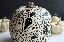 08 a cool and scary white pumpkin decorated with spiders, skulls and ghosts is a lovely idea for Halloween