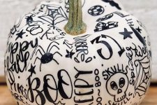 09 a fun contrasting pumpkin in white, decorated with a black sharpie, can be a nice idea for a modern Halloween party or just as decor