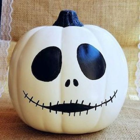 A Jack Skellington inspired pumpkin   a white piece decorated with a black sharpie is a great idea for Halloween