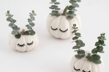 10 beautiful and cute white pumpkins with sharpie eyelashes and eucalyptus will be a cool and lovely idea for the fall and Halloween