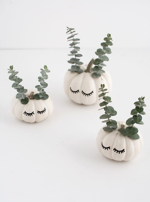 beautiful and cute white pumpkins with sharpie eyelashes and eucalyptus will be a cool and lovely idea for the fall and Halloween