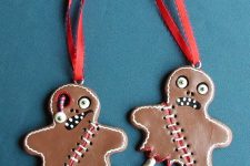 12 scary gingerbread style Halloween ornaments of faux leather, with stitching and eyes are jaw-dropping