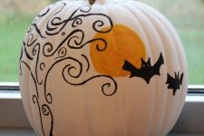 13 a white pumpkin decorated with a black and an orange sharpie in Halloween style is a fun and cool idea to rock