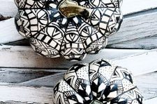 15 beautiful white pumpkins with black mandalas drawn with a sharpie on them are amazing for boho Halloween decor
