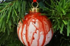 16 a bleeding Halloween ornament on red ribbon can be easily made for holidays, it looks cool and bold