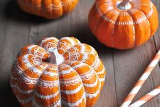 17 classic orange pumpkins decorated with a white sharpie with some lace patterns look very chic, nice and fun and can be easily DIYed