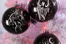 21 beautiful black ornaments with white images are amazing for Halloween decor, they never go out of style