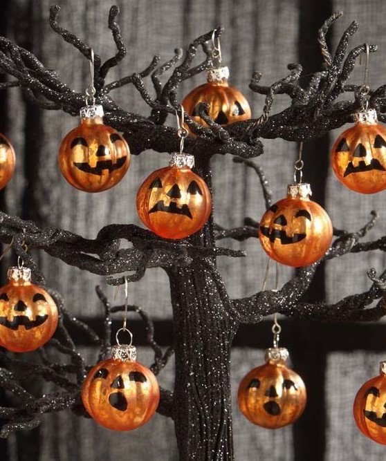 Orange jack o lanterns Halloween ornaments are amazing for styling your Halloween tree and are easy to DIY