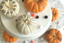 24 white and orange pumpkins decorated with a black sharpie are a nice solution for Halloween and for the fall, too