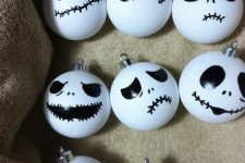 25 take usual white Christmas ornaments and turn them into spooky Halloween ones, and black and white are traditional colors