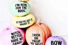 28 an arrangement of Halloween pumpkins with fun and quirky phrases on them for a modern touch