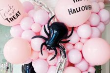 30 jaw-dropping Halloween decor with pink ballons, oversized black spider balloons, chains is fantastic for a party