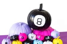 32 colorful and neon pumpkins with various decor and letters for a bright Halloween party