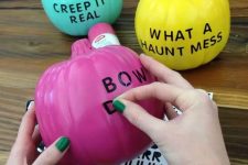 33 colorful modern pumpkins with no carve decor, only letter stickers for Halloween are a great idea for a modern Halloween space