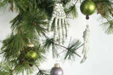 35 skeleton hands paired with more traditional Christmas ornaments will give an ultimate look to your Halloween tree