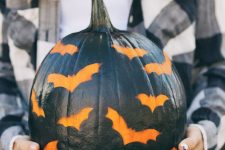 45 a black pumpkin stenciled with bats is a great idea for a modern rustic party or for your porch and it’s easy to make