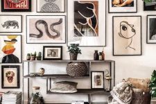 a statement gallery wall with thin black frames and black and white matting built around a central piece