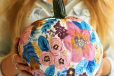 09 a white pumpkin painted with blue leaves and pink blooms is a beautiful and cute solution for a pastel fall space