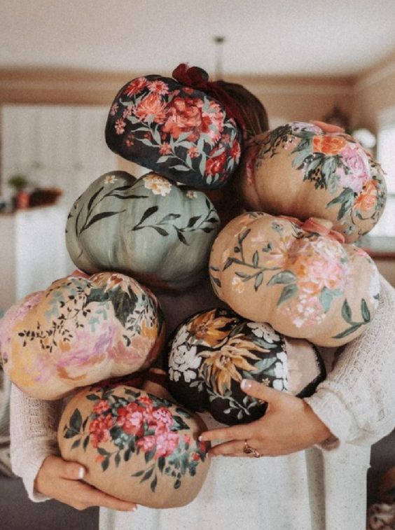 a whole number of gorgeous hand painted pumpkins in various colors will boost your fall or Thanksgiving decor