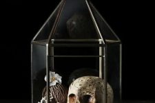 13 a terrarium with a skull, a black pearl, a faux bloom and driftwood is a beautiful and cool idea for vintage Halloween decor