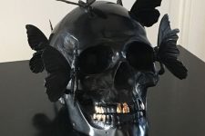 16 a black skull decorated with butterflies is a gorgeous and very creative Halloween decoration and looks very eye-catchy