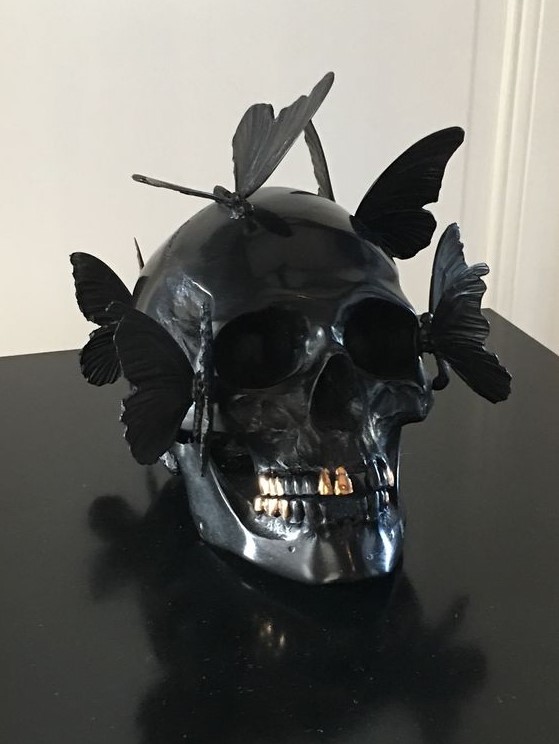A black skull decorated with butterflies is a gorgeous and very creative Halloween decoration and looks very eye catchy