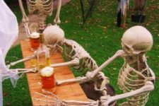 17 a beer drinking skeleton Halloween scene is a simple ro realize and cool idea for hilarious decor