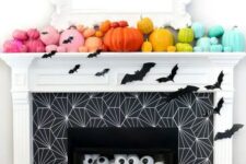 19 a rainbow pumpkin mantel with bats, eyeballs in the fireplace for fun and bold Halloween styling