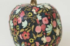 22 a pumpkin decorated with black floral stripes to make your Halloween ultimate without spending much time