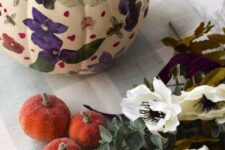 26 a white pumpkin with purple, red and white decoupage blooms and petals looks amazing and will be perfect for fall decor