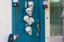 32 a skull hanging will be a nice idea for decorating your front door for Halloween, instead of a usual wreath