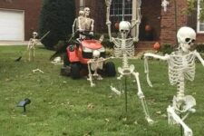 34 a lawnmower skeleton scene like this one is a very fun and cool idea for any outdoor space at Halloween, and it looks awesome