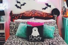 40 a bright Halloween bedroom done in pink, green, black and white, with bats, neon lights and lots of prints is super fun