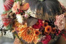 41 a stunning black and gold Halloween pumpkin with orange, red, blush and black blooms, berries and pincushion proteas