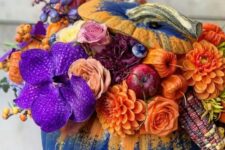 42 a stunning Thanksgiving pumpkin in electric blue with yellow, with orange, violet, deep purple and burgundy blooms, corn cobs and apples