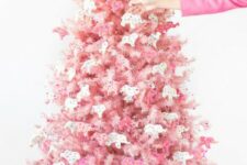 02 a blush Christmas tree decorated with pink and white circus animal cookie ornaments is a creative solution with color and unique ornaments
