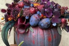 06 a gorgeous purple and red pumpkin decorated with plum and deep purple blooms, berries and fruits, bunny tails and foliage