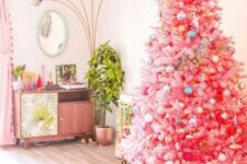 07 a bright pink Christmas tree with pastel and metallic ornaments and a large gold star topper for infusing your space with color