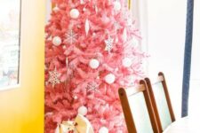 10 a delicate pink Christmas tree decorated with white ornaments of various looks is a tasteful and very girlish choice