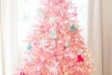 13 a light pink Christmas tree with lights and vintage ornaments and toys is a lovely idea for a kids’ room