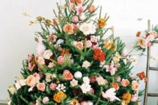 15 a beautiful Christmas tree with orange, rust, burgundy, blush and pink blooms, some branches and leaves is a very cute and romantic idea