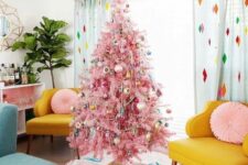 18 a pink Christmas tree decorated with vintage ornaments and beads, a bright tree skirt with images for a vintage space